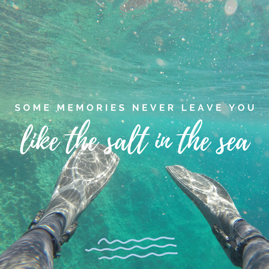 Some Memories Never Leave You, Like the Salt in the Sea. Text overlaying fins in water.