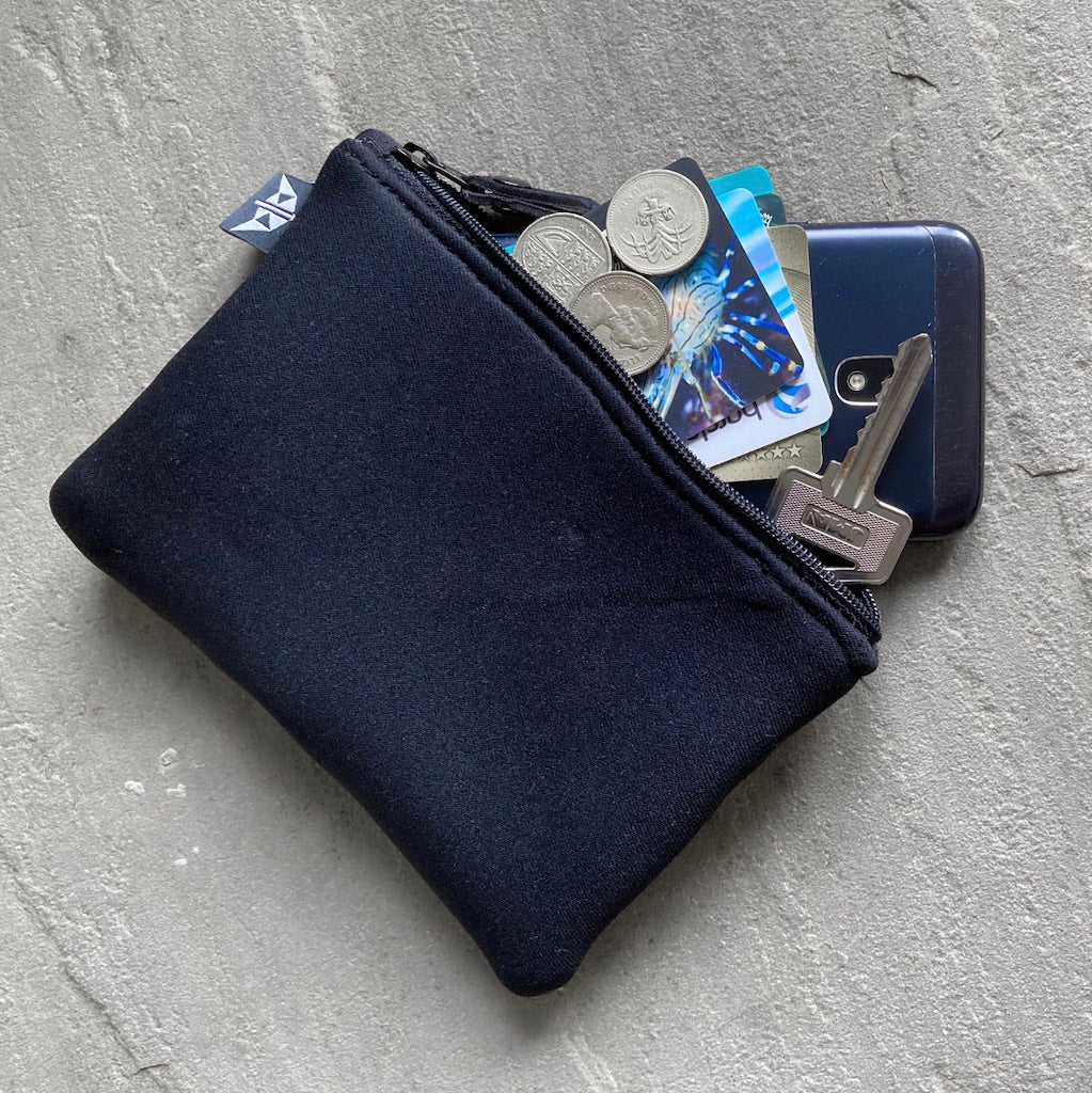 Earthbound Rectangle Neoprene Pouch in Black with personal belongings